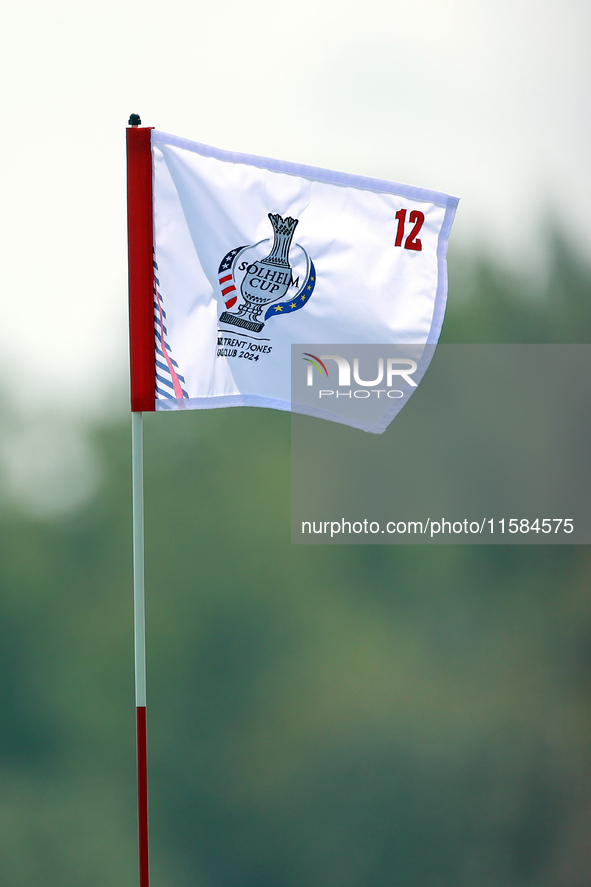 GAINESVILLE, VIRGINIA - SEPTEMBER 15: The flag at the 12th green wafts in the breeze during the final round of the Solheim Cup at Robert Tre...