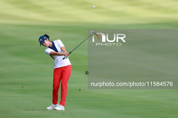 GAINESVILLE, VIRGINIA - SEPTEMBER 15: Andrea Lee of the United States hits from the 12th fairway during the final round of the Solheim Cup a...