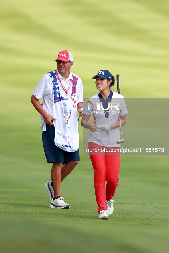 GAINESVILLE, VIRGINIA - SEPTEMBER 15: Andrea Lee of the United States walks with her caddie on the 12th fairway during the final round of th...