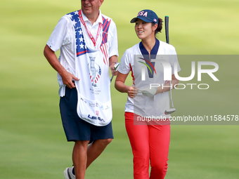 GAINESVILLE, VIRGINIA - SEPTEMBER 15: Andrea Lee of the United States walks with her caddie on the 12th fairway during the final round of th...