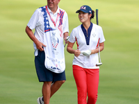 GAINESVILLE, VIRGINIA - SEPTEMBER 15: Andrea Lee of the United States walks with her caddie on the 12th fairway during the final round of th...