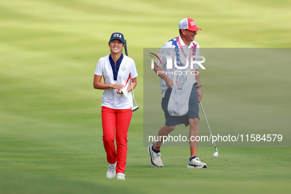 GAINESVILLE, VIRGINIA - SEPTEMBER 15: Andrea Lee of the United States walks with her caddie on the 12th fairway during the final round of th...