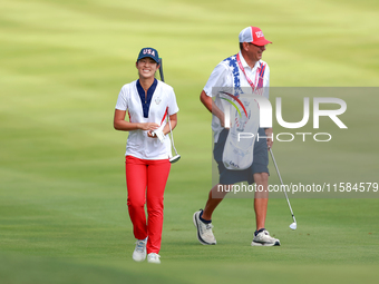 GAINESVILLE, VIRGINIA - SEPTEMBER 15: Andrea Lee of the United States walks with her caddie on the 12th fairway during the final round of th...