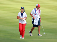 GAINESVILLE, VIRGINIA - SEPTEMBER 15: Andrea Lee of the United States walks with her caddie on the 12th fairway during the final round of th...