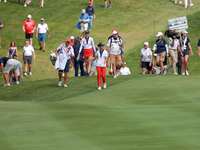 GAINESVILLE, VIRGINIA - SEPTEMBER 15: Andrea Lee of the United States walks with her caddie on the 12th fairway during the final round of th...