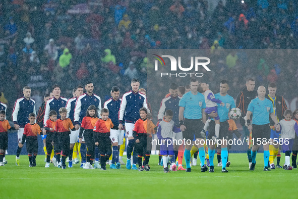 Players on the pitch under the rain during the UEFA Champions League 2024/25 League Phase MD1 match between Bologna FC and FC Shakhtar Donet...