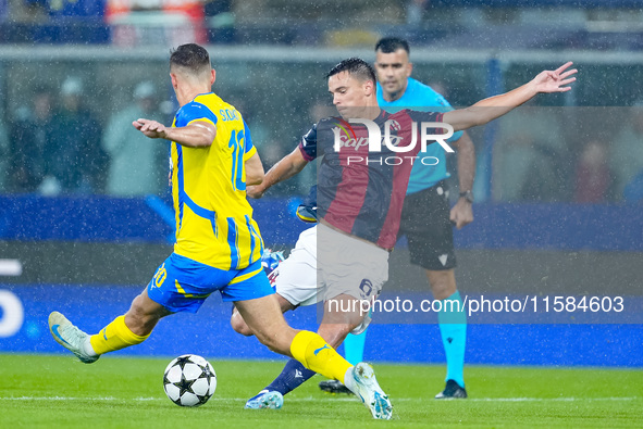 Heorhiy Sudakov of FC Shakhtar Donetsk and Nikola Moro of Bologna FC compete for the ball during the UEFA Champions League 2024/25 League Ph...