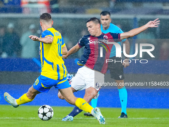 Heorhiy Sudakov of FC Shakhtar Donetsk and Nikola Moro of Bologna FC compete for the ball during the UEFA Champions League 2024/25 League Ph...