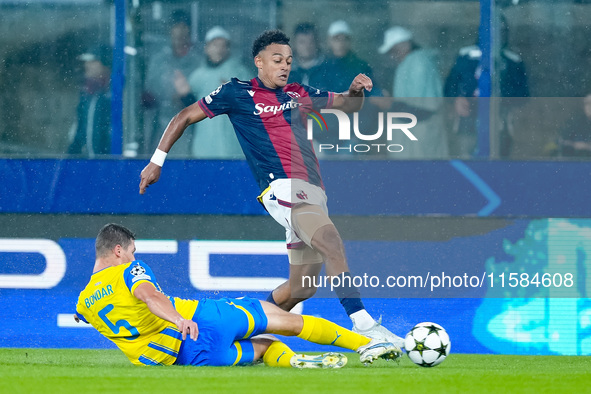 Dan Ndoye of Bologna FC and Valeriy Bondar of FC Shakhtar Donetsk compete for the ball during the UEFA Champions League 2024/25 League Phase...