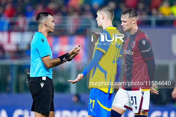 Referee tallks to Artem Bondarenko of FC Shakhtar Donetsk and Sam Beukema of Bologna FC during the UEFA Champions League 2024/25 League Phas...