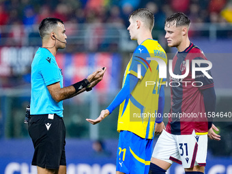 Referee tallks to Artem Bondarenko of FC Shakhtar Donetsk and Sam Beukema of Bologna FC during the UEFA Champions League 2024/25 League Phas...