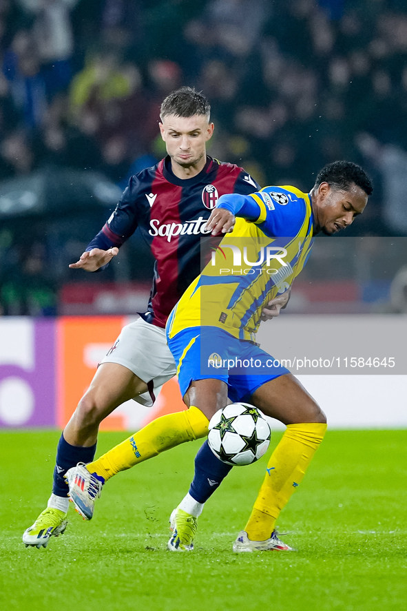 Stefan Posch of Bologna FC and Newerton of FC Shakhtar Donetsk compete for the ball during the UEFA Champions League 2024/25 League Phase MD...