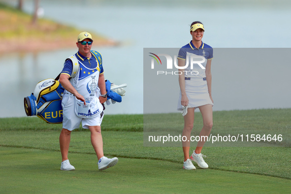 GAINESVILLE, VIRGINIA - SEPTEMBER 15: Esther Henseleit of Team Europe walks with her caddie on the 12th fairway during the final round of th...