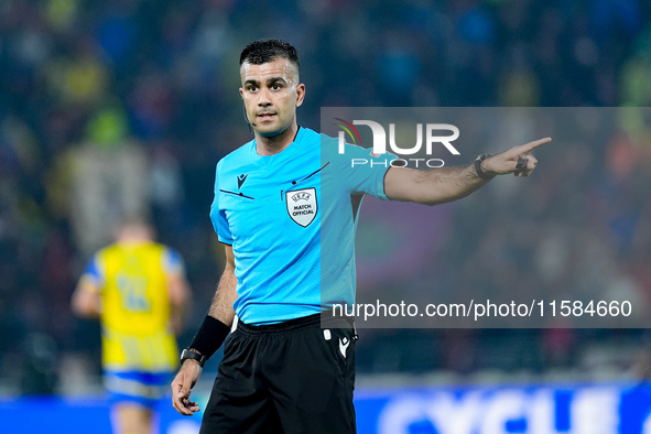 referee Rohit Saggi gestures during the UEFA Champions League 2024/25 League Phase MD1 match between Bologna FC and FC Shakhtar Donetsk at S...