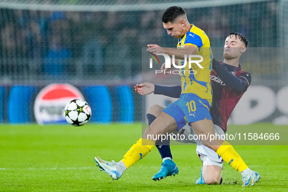 Sam Beukema of Bologna FC and Heorhiy Sudakov of FC Shakhtar Donetsk compete for the ball during the UEFA Champions League 2024/25 League Ph...