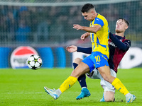 Sam Beukema of Bologna FC and Heorhiy Sudakov of FC Shakhtar Donetsk compete for the ball during the UEFA Champions League 2024/25 League Ph...