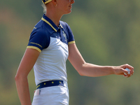 GAINESVILLE, VIRGINIA - SEPTEMBER 15: Esther Henseleit of Team Europe walks with her caddie from the 12th green during the final round of th...