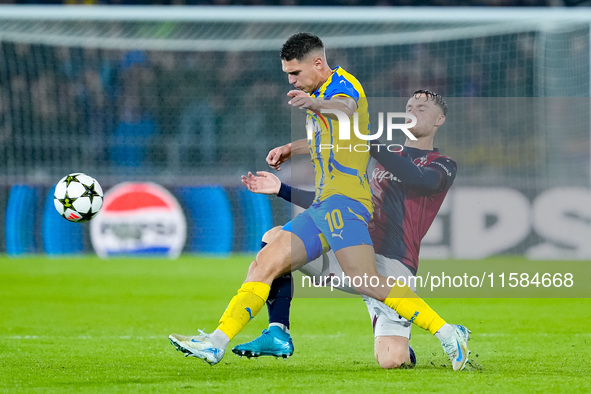 Sam Beukema of Bologna FC and Heorhiy Sudakov of FC Shakhtar Donetsk compete for the ball during the UEFA Champions League 2024/25 League Ph...