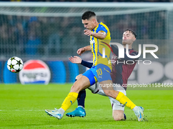 Sam Beukema of Bologna FC and Heorhiy Sudakov of FC Shakhtar Donetsk compete for the ball during the UEFA Champions League 2024/25 League Ph...