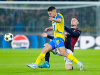 Sam Beukema of Bologna FC and Heorhiy Sudakov of FC Shakhtar Donetsk compete for the ball during the UEFA Champions League 2024/25 League Ph...