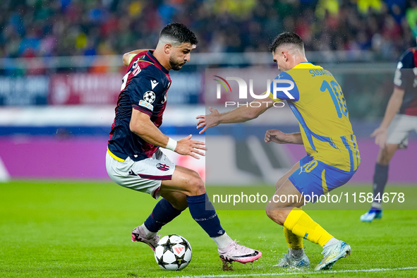 Riccardo Orsolini of Bologna FC and Heorhiy Sudakov of FC Shakhtar Donetsk compete for the ball during the UEFA Champions League 2024/25 Lea...