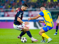 Riccardo Orsolini of Bologna FC and Heorhiy Sudakov of FC Shakhtar Donetsk compete for the ball during the UEFA Champions League 2024/25 Lea...