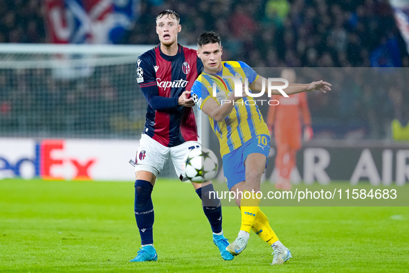 Sam Beukema of Bologna FC nd Heorhiy Sudakov of FC Shakhtar Donetsk compete for the ball during the UEFA Champions League 2024/25 League Pha...