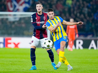 Sam Beukema of Bologna FC nd Heorhiy Sudakov of FC Shakhtar Donetsk compete for the ball during the UEFA Champions League 2024/25 League Pha...