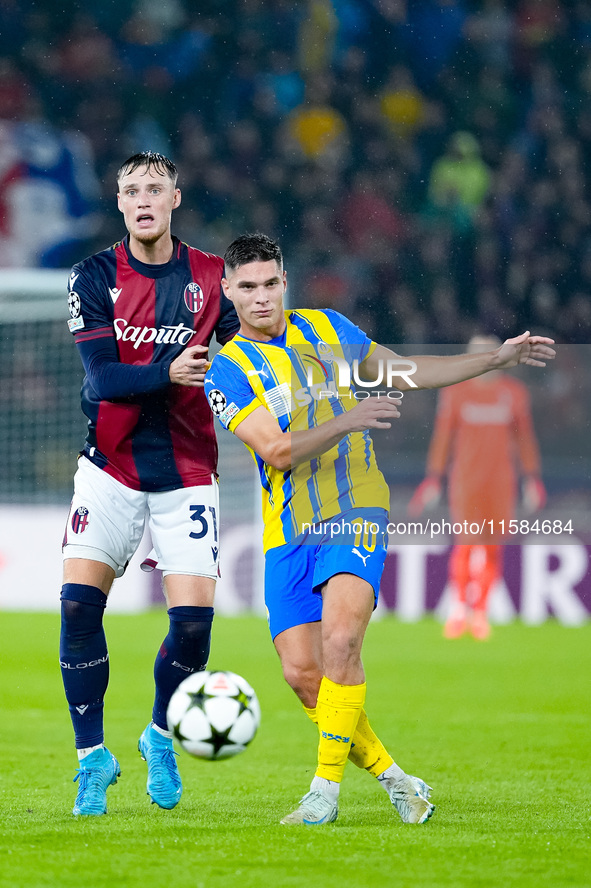 Sam Beukema of Bologna FC nd Heorhiy Sudakov of FC Shakhtar Donetsk compete for the ball during the UEFA Champions League 2024/25 League Pha...