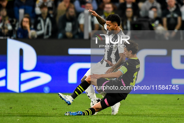 Douglas Luiz of Juventus fights for the ball with Johan Bakayoko of PSV during the UEFA Champions League 2024/25 League Phase MD1 match betw...