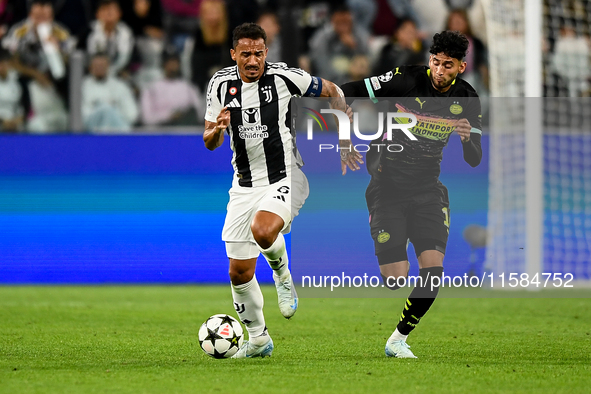 Danilo of Juventus fights for the ball with Ricardo Pepi of PSV during the UEFA Champions League 2024/25 League Phase MD1 match between Juve...