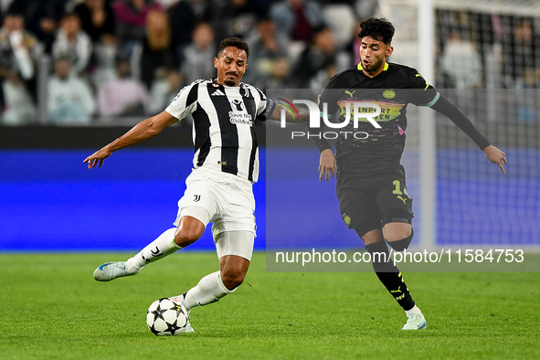 Danilo of Juventus fights for the ball with Ricardo Pepi of PSV during the UEFA Champions League 2024/25 League Phase MD1 match between Juve...