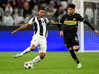 Danilo of Juventus fights for the ball with Ricardo Pepi of PSV during the UEFA Champions League 2024/25 League Phase MD1 match between Juve...