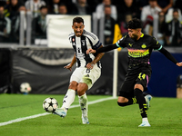 Danilo of Juventus fights for the ball with Ricardo Pepi of PSV during the UEFA Champions League 2024/25 League Phase MD1 match between Juve...