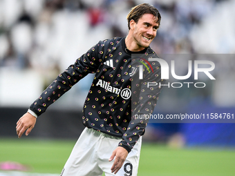 Dusan Vlahovic smiles for Juventus during the UEFA Champions League 2024/25 League Phase MD1 match between Juventus and PSV Eindhoven at Juv...