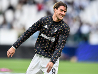 Dusan Vlahovic smiles for Juventus during the UEFA Champions League 2024/25 League Phase MD1 match between Juventus and PSV Eindhoven at Juv...