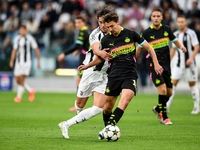 Dusan Vlahovic of Juventus fights for the ball with Oliviero Boscagli of PSV during the UEFA Champions League 2024/25 League Phase MD1 match...