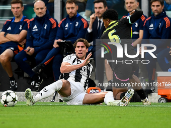 Dusan Vlahovic of Juventus fights for the ball with Ryan Flamingo of PSV during the UEFA Champions League 2024/25 League Phase MD1 match bet...