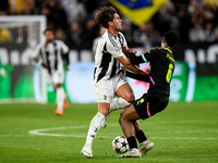 Dusan Vlahovic of Juventus contends for the ball with Ryan Flamingo of PSV during the UEFA Champions League 2024/25 League Phase MD1 match b...