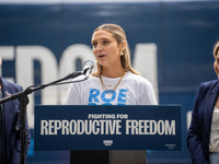 Activist Hadley Duvall, 22, speaks at a Harris-Walz Fighting for Reproductive Freedom press conference at the Pennsylvania State Capitol in...