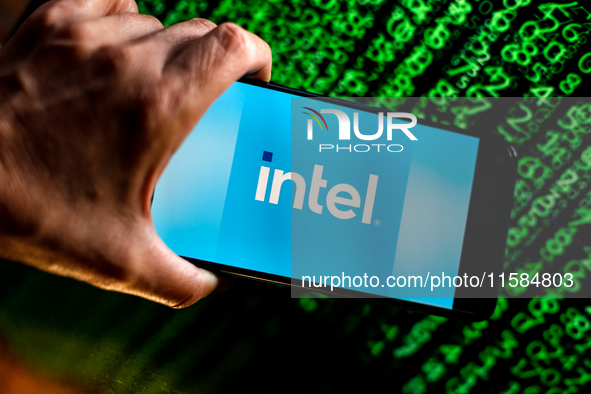 In this photo illustration, the Nvidia logo is seen displayed on a smartphone screen against a computer screen displaying a matrix image, as...