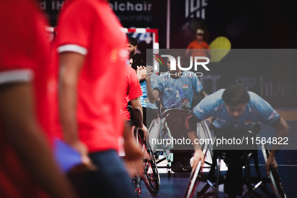 India's player shakes hands with Egypt's player before the start of the match at the World Wheelchair Handball Championship in Egypt, on Sep...