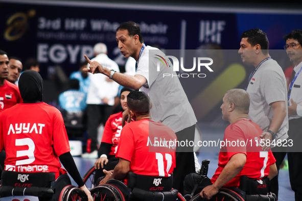 Egypt's national team coach speaks to the team before the start of the match at the World Wheelchair Handball Championship in Egypt, on Sept...