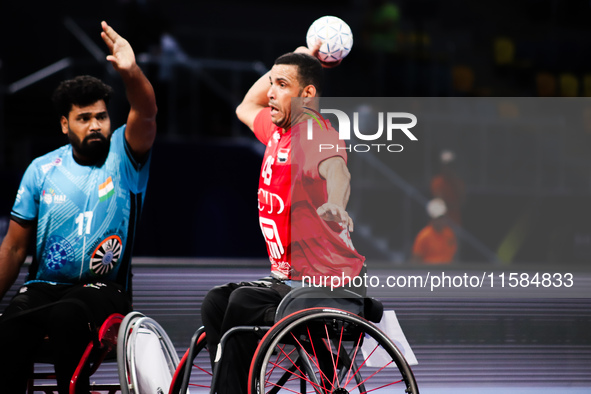 Egypt's player kicks the ball to his teammate during their match against India at the World Wheelchair Handball Championship in Egypt, on Se...