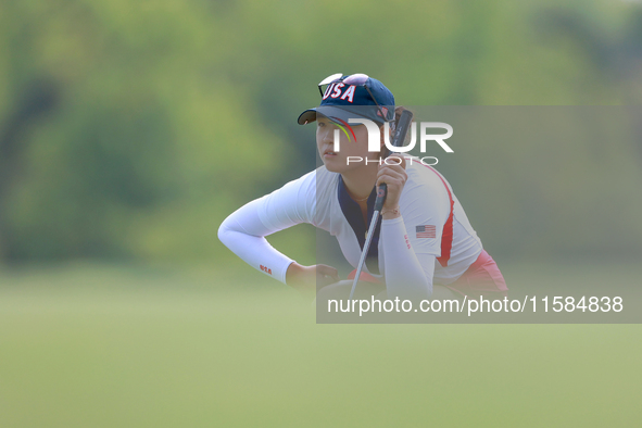 GAINESVILLE, VIRGINIA - SEPTEMBER 15: Rose Zhang of the United States lines up her putt on the 12th green during the final round of the Solh...