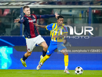 Newerton of FC Shakhtar Donetsk and Stefan Posch of Bologna FC compete for the ball during the UEFA Champions League 2024/25 League Phase MD...