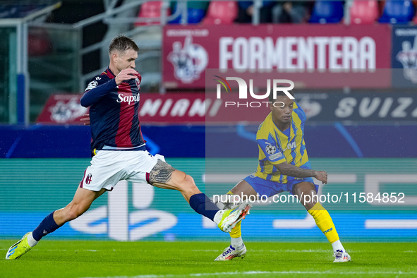 Newerton of FC Shakhtar Donetsk and Stefan Posch of Bologna FC compete for the ball during the UEFA Champions League 2024/25 League Phase MD...