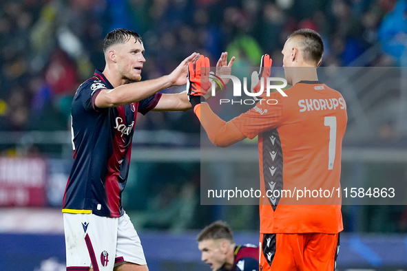 Sam Beukema of Bologna FC and Lukasz Skorupski of Bologna FC during the UEFA Champions League 2024/25 League Phase MD1 match between Bologna...