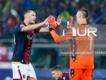 Sam Beukema of Bologna FC and Lukasz Skorupski of Bologna FC during the UEFA Champions League 2024/25 League Phase MD1 match between Bologna...