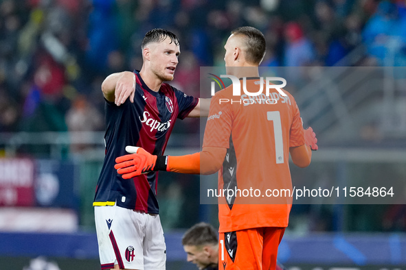 Sam Beukema of Bologna FC and Lukasz Skorupski of Bologna FC during the UEFA Champions League 2024/25 League Phase MD1 match between Bologna...